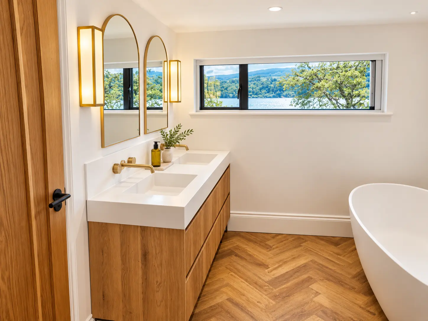 Bathroom with double oak vanity, brass fittings, freestanding bath and loch-view window