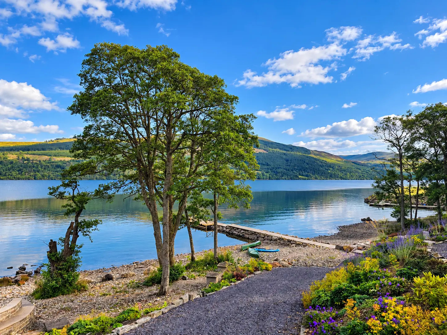 Garden path leading to the private shore and stone jetty on Loch Tay
