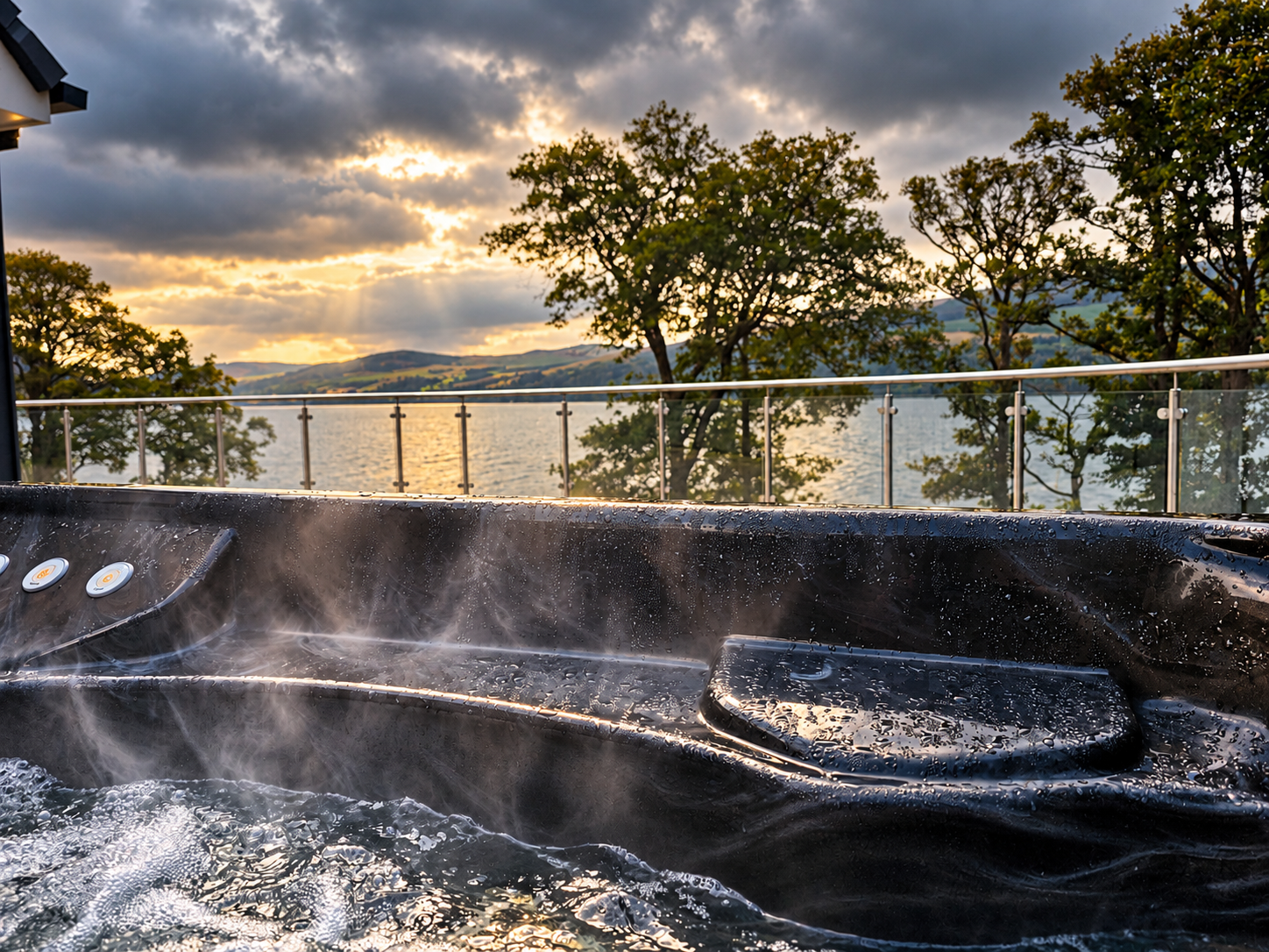 Steam rising from the hot tub on the terrace as the sun sets over Loch Tay