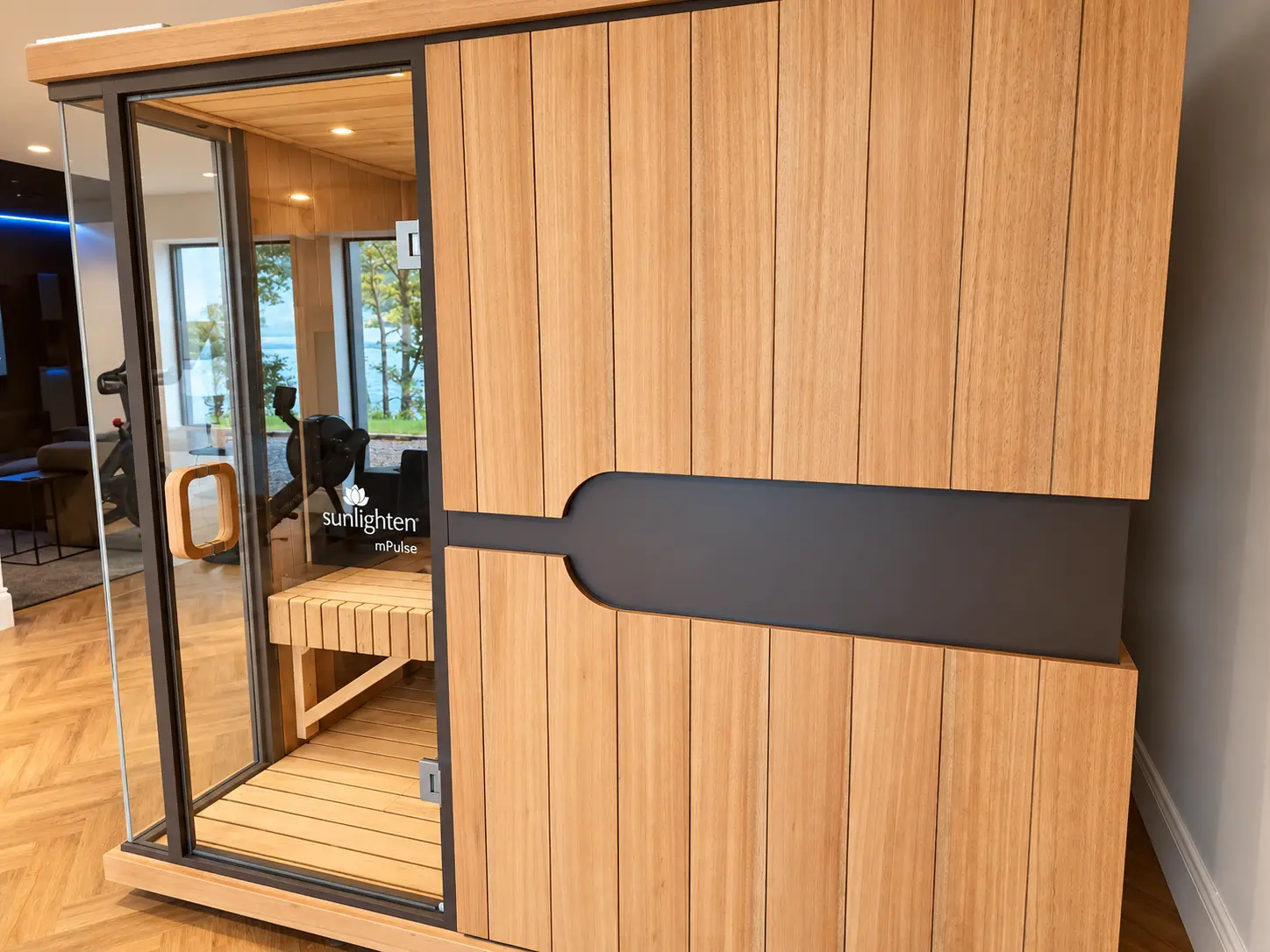 Timber-clad Sunlighten infrared sauna with glass door